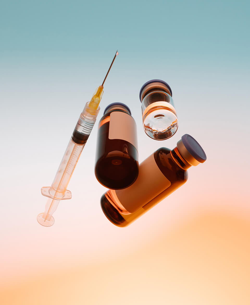 Syringe and amber vials of compounded medication