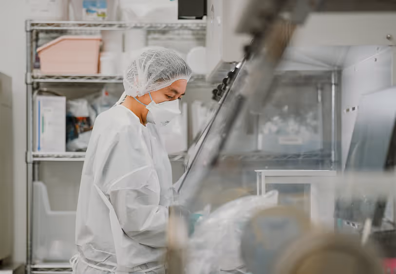 Technician in a sterile compounding cleanroom