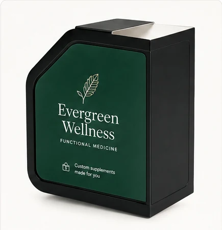 A dispenser carrying Evergreen Wellness branding — deep green panel, leaf mark, 'custom supplements made for you.'