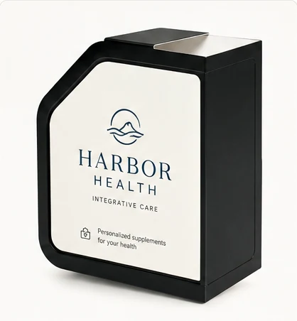 A dispenser carrying Harbor Health branding — cream panel with a navy harbor mark.